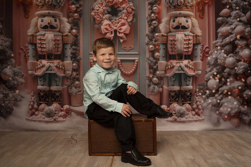 A young boy poses in a Christmas setting with Simply Shelayna Family Photographer in Syracuse NY.