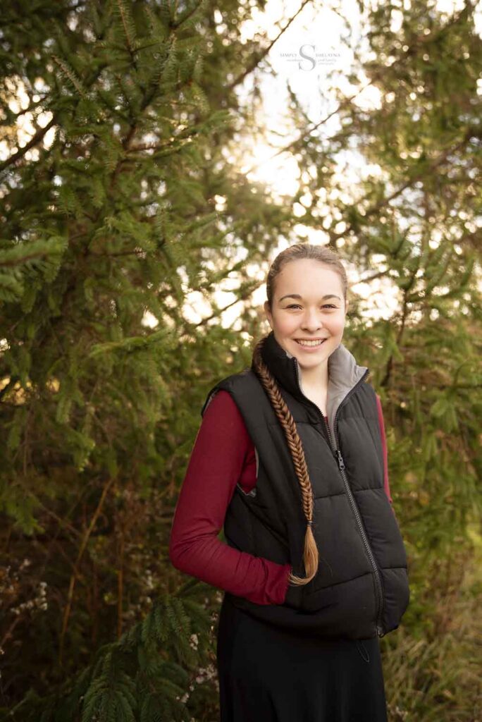 A teenage girl, surrounded by nature, is photographed by Simply Shelayna Family Photography in Syracuse NY for a birthday portrait. 