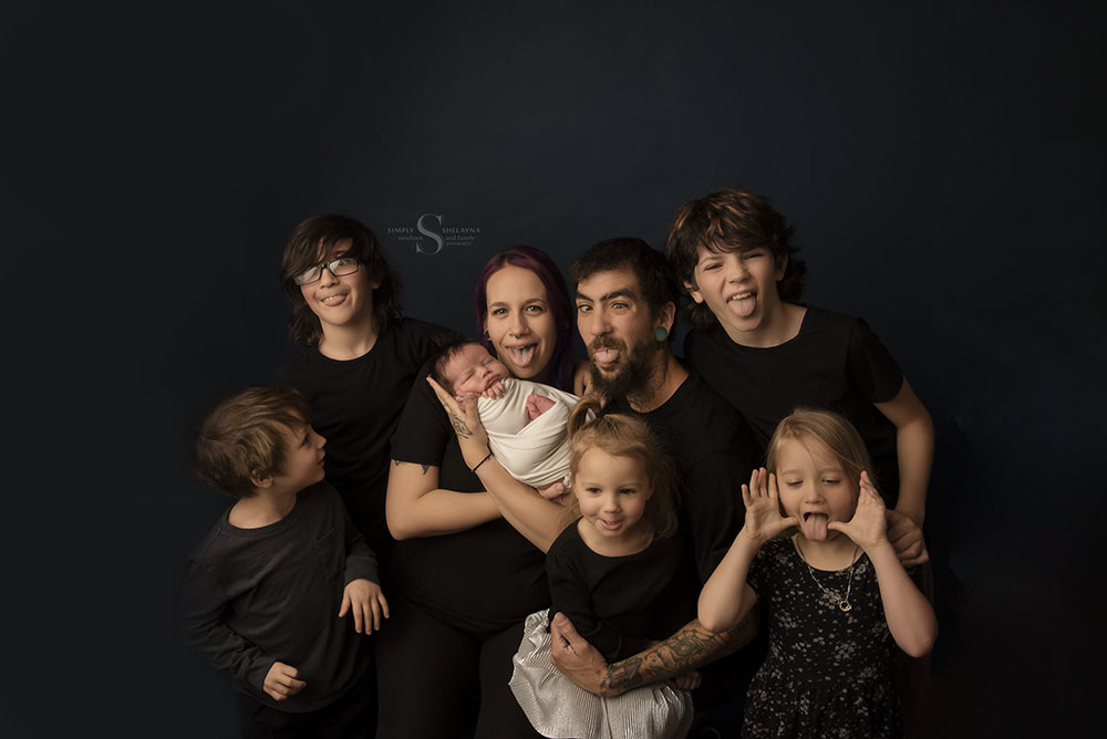 A family of yours, mine, and ours, get silly for a family portrait with Simply Shelayna Family Photography in CNY.