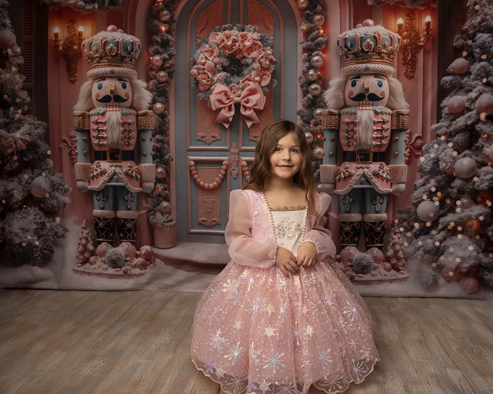 A young girl wears a pink Christmas nutcracker gown for a Christmas portrait with Simply Shelayna Family Photography in Oswego NY.