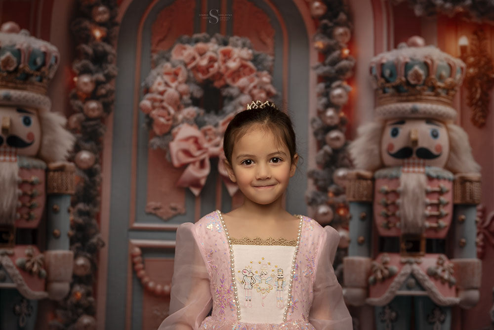 A young girl poses for a portrait with Simply Shelayna Photography in Syracuse NY.