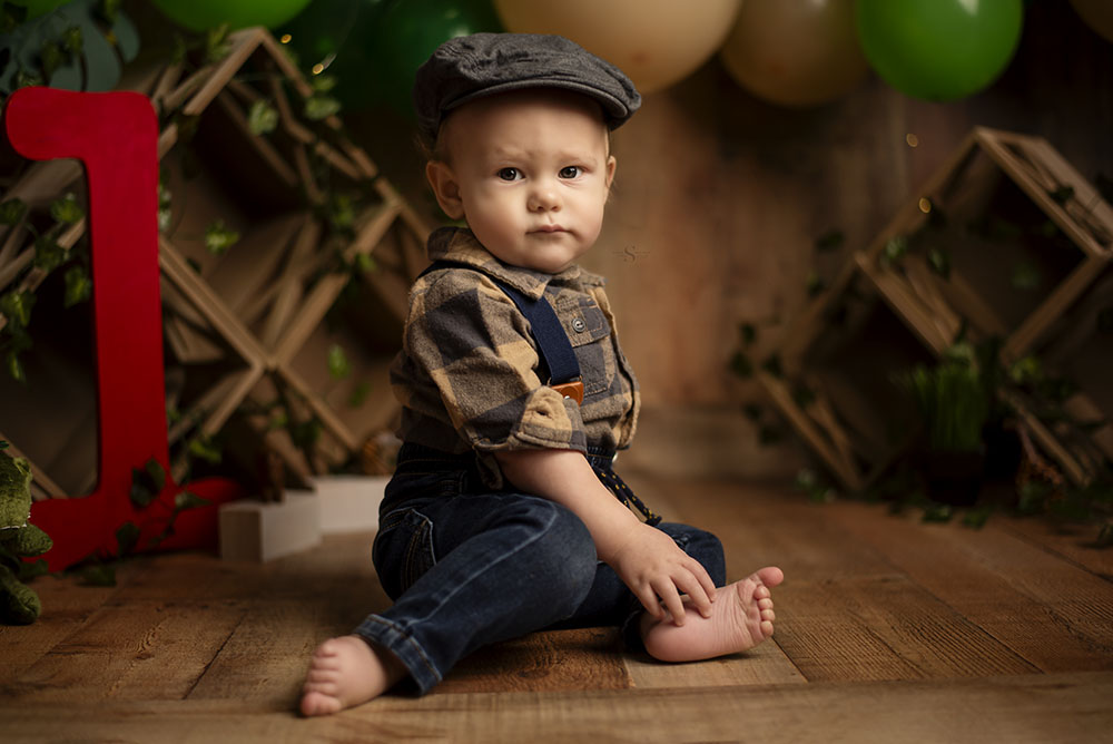 A little boy celebrates his first year birthday milestone with Simply Shelayna Baby Photography of CNY.
