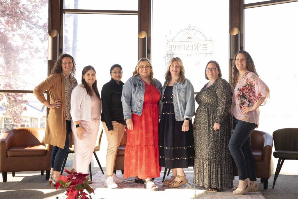 The panel to Pregnant and Prepared Spring 2026 gather for a photo at 114 Reserve Cafe in Fulton NY with Simply Shelayna Newborn and Maternity Photography.