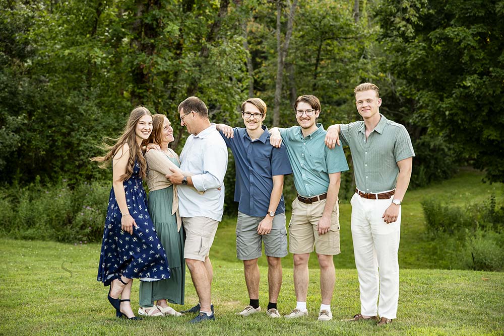 A family of 6 with 4 grown children pose for a portrait with Simply Shelayna Family Photography in CNY.
