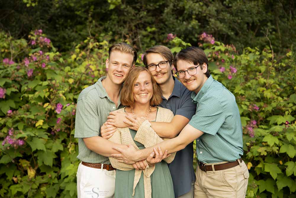 Three sons embrace their mother for a portrait with Simply Shelayna Family Photography in Syracuse NY.